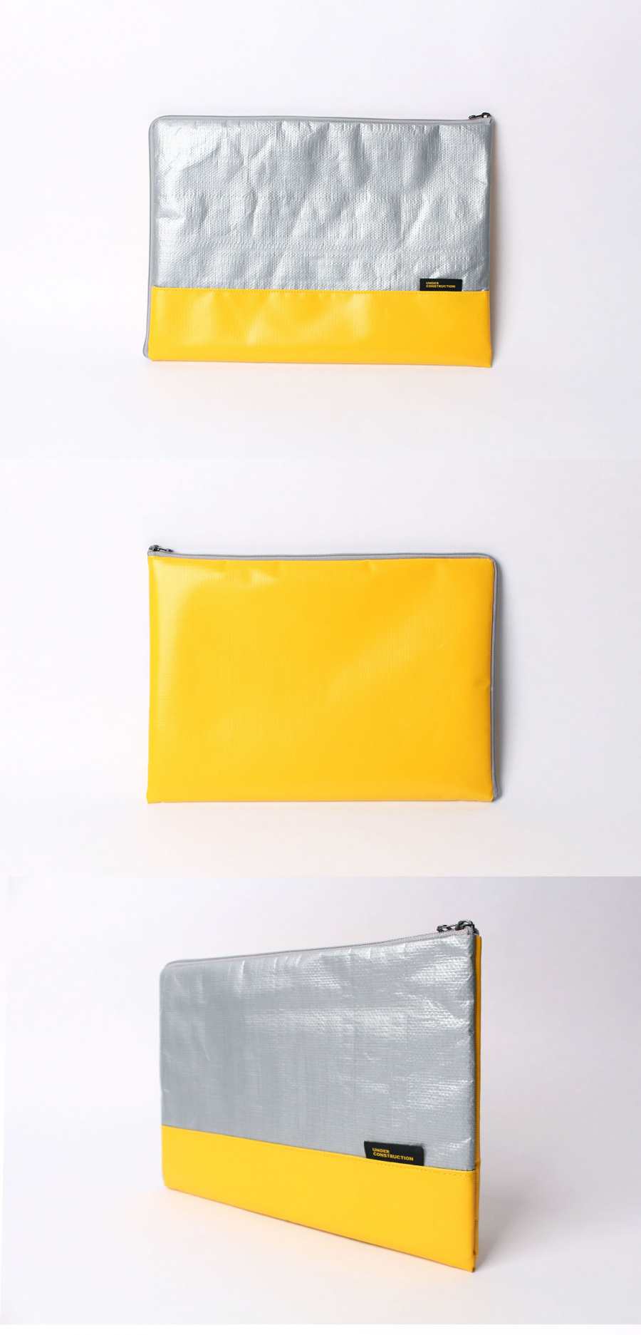언더 컨스트(UNDER CONST.) 노트북파우치 옐로우