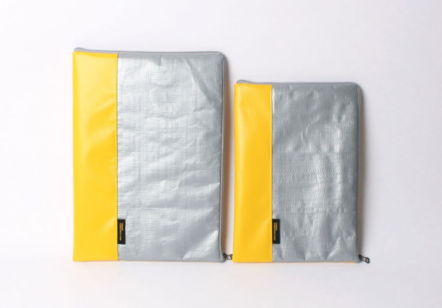 언더 컨스트(UNDER CONST.) 노트북파우치 옐로우