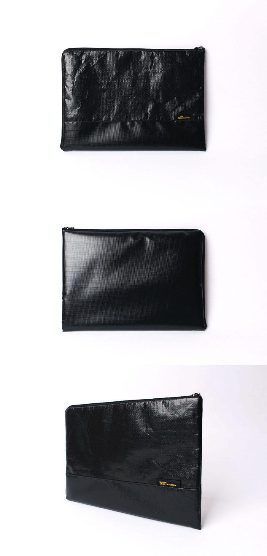 언더 컨스트(UNDER CONST.) 노트북파우치 블랙