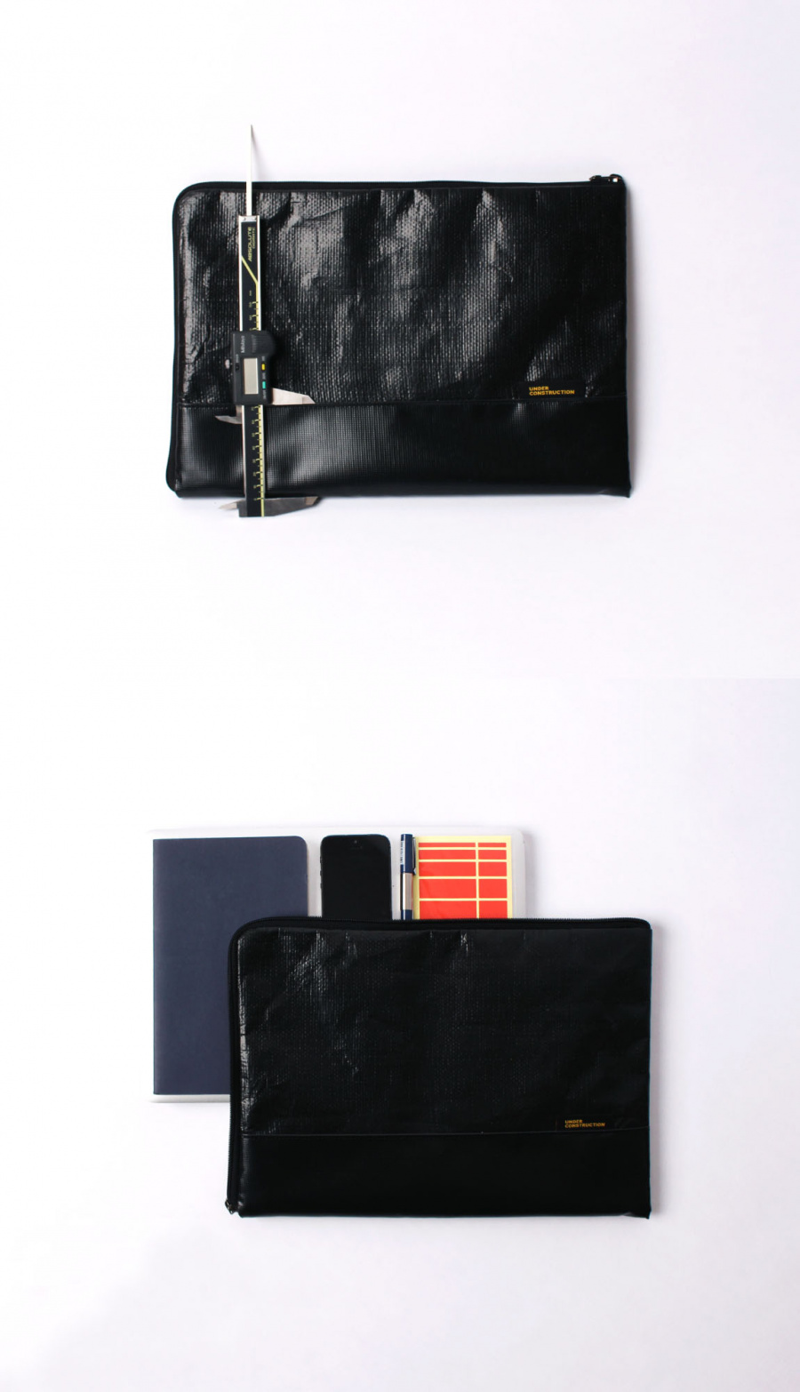 언더 컨스트(UNDER CONST.) 노트북파우치 블랙