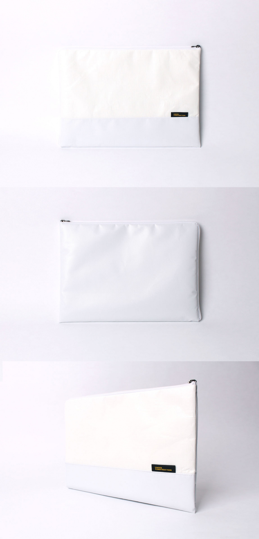 언더 컨스트(UNDER CONST.) 노트북파우치 화이트