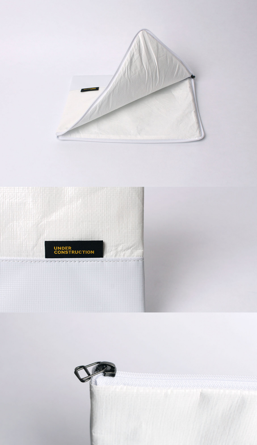 언더 컨스트(UNDER CONST.) 노트북파우치 화이트