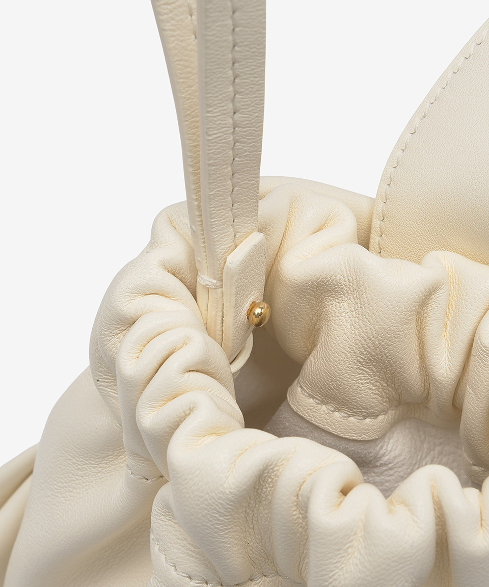 MUSINSA | JIL SANDER Bow pouch bag - Off-White