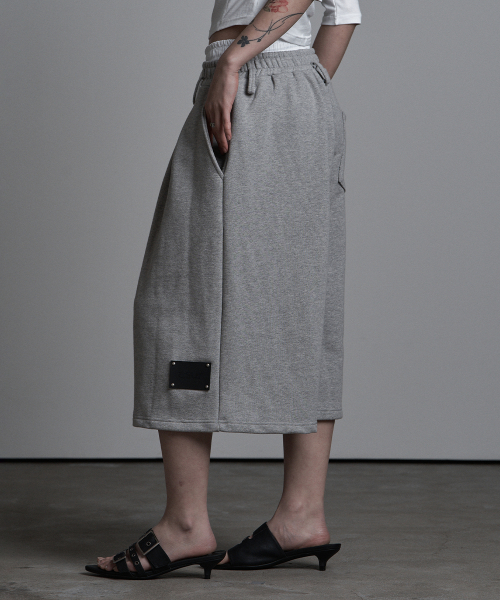 SAGGING FLARE BERMUDA PANTS MELANGE