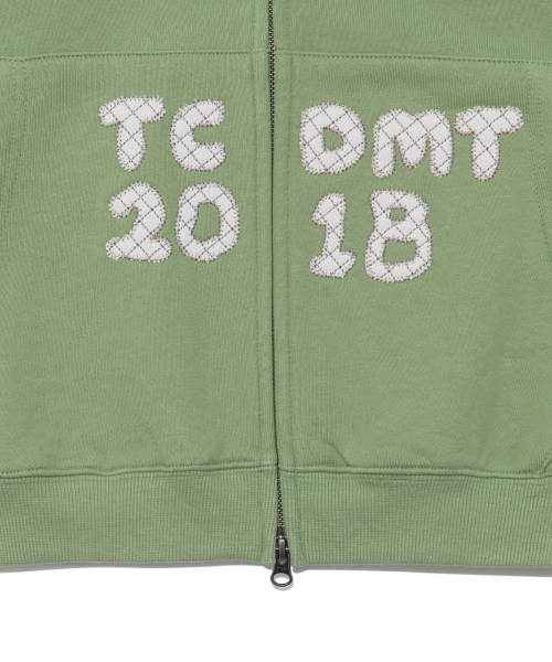 TCM logo applique hooded zip-up (green)