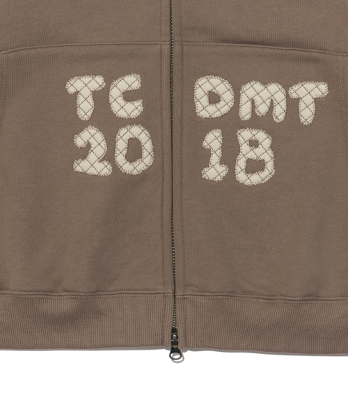 TCM logo applique hooded zip-up (brown)
