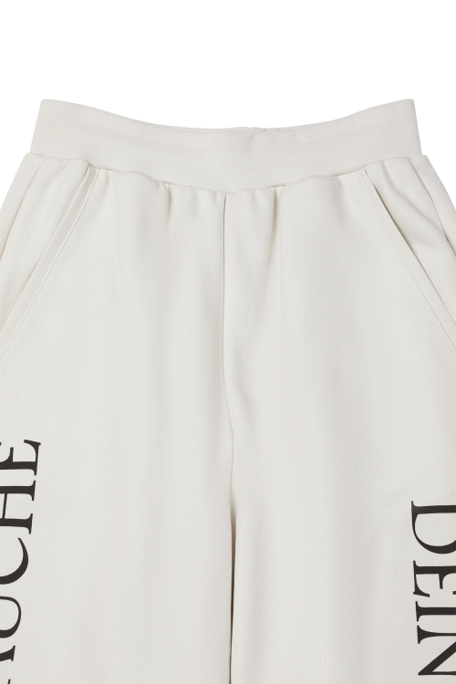 GERMAN LETTERING SWEATPANTS IN IVORY